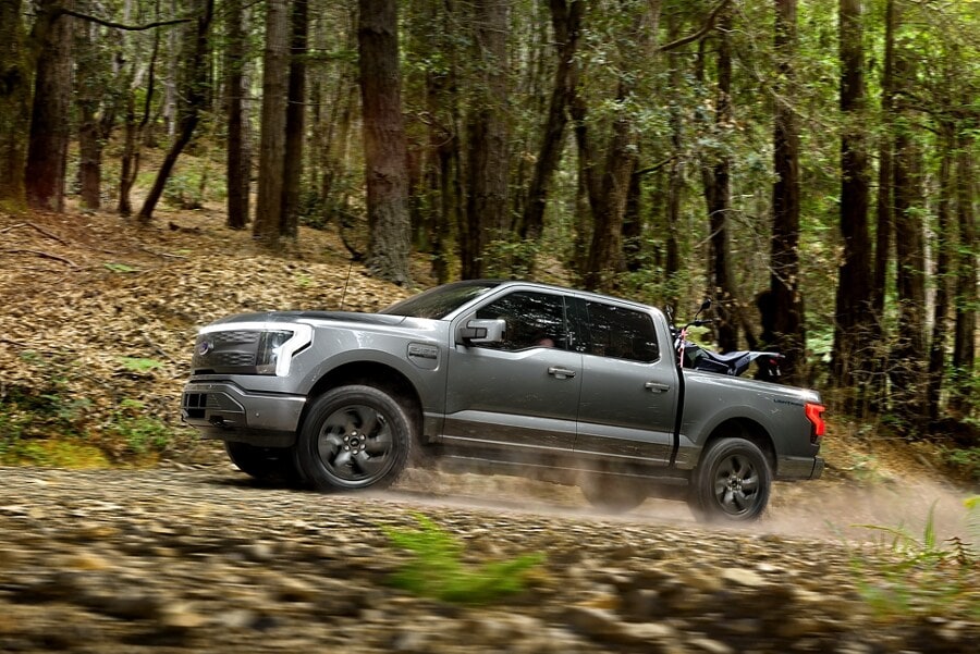 Ford F-150 Lightning driving in woods